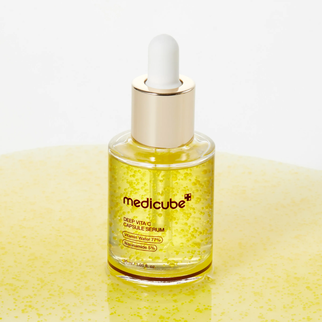 Medicube Deep Vita C Capsule Serum bottle on yellow background